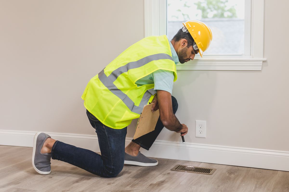 Professional inspecting a residential property